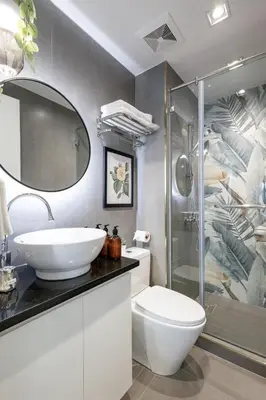 a bathroom with a sink and a toilet and a shower at NEW! Beautiful Studio in Greenbelt Makati in Manila