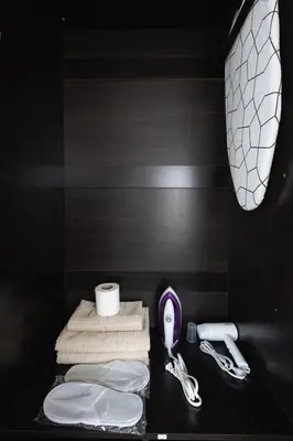 a bathroom with two towels and a sink at Free Parking! Beautiful 2BR Home in Central Makati in Manila