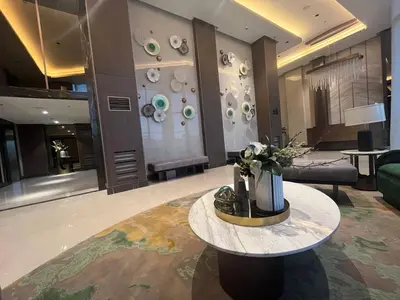 a living room with a table and a couch at Gentry Manor Manila Bay Okada Complex MOA&Airport WiFi Netflix 8K in Manila