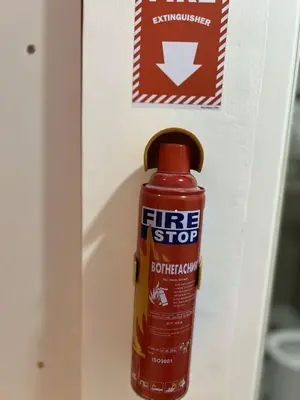 a firestop hot sauce bottle in a refrigerator door at Modern Studio near MOA, Airport & Heart of Pasay in Manila