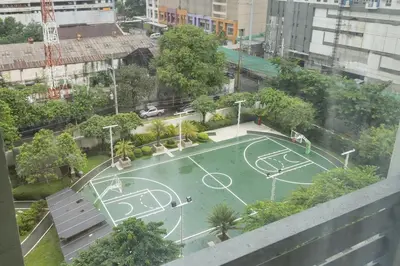 a tennis court in the middle of a city at NEW 2BR Family Home with FREE Parking & Fiber Wi-Fi in Manila