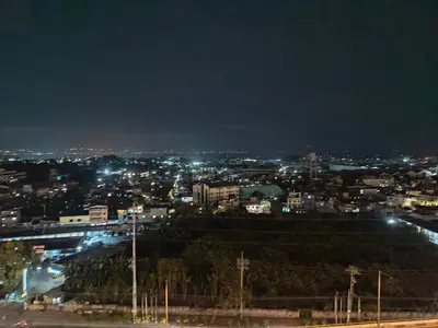 a view of a city at night with lights at The Dream Den Staycation in Manila