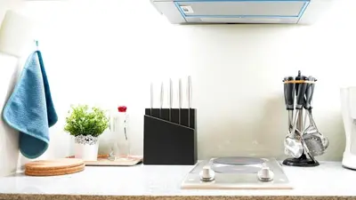 a kitchen counter with a stove and other kitchen utensils at Best 1BR in Uptown BGC - Near Mitsukoshi & Malls in Manila