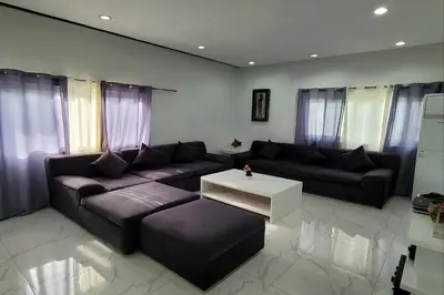 a living room with a couch and a table at Jewelry Resort and Villas Tagaytay in Silang