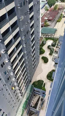 an aerial view of two tall buildings in a city at The Cozy Hub Studio with Wifi Near Eastwood City in Manila