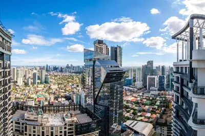 an aerial view of a city with tall buildings at StayHere 3BR Penthouse Knightsbridge Makati in Manila