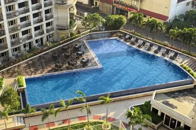 an overhead view of a large swimming pool on a building at Extremeli Suites in Manila