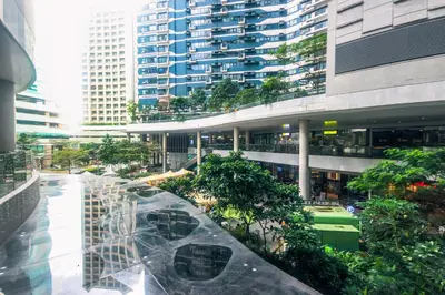 a view of a building with trees and buildings at Beauty Makati Penthouse 4 room Family Condo in Manila