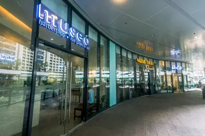 a shopping mall with a person sitting inside of it at Beauty Makati Penthouse 4 room Family Condo in Manila