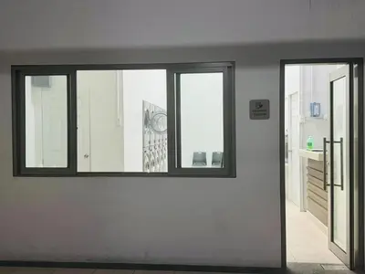 a room with three windows and a white wall at Near NAIA 3 Condo in Manila