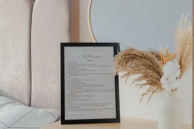 a menu on a table next to a lamp at Family Friendly Stay UrbanDeca in Manila
