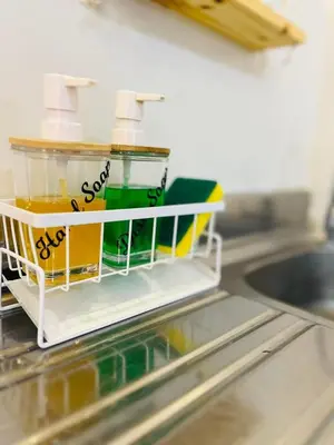 a toy dish rack on a counter in a kitchen at Fablo Staycation By Enchanted Kingdom in Santa Rosa