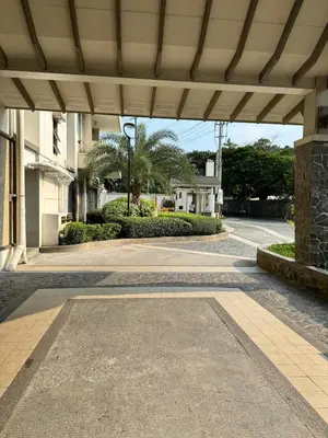 an empty walkway in a building with a roof at Studio Suite at Fairway Terraces near NAIA T3 in Manila