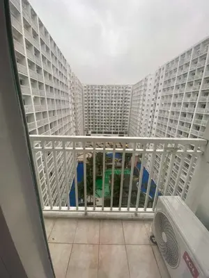 a view from a balcony of a large apartment building at Spacious 2BR Suites at MOA in Manila