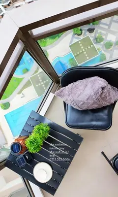 a table with a tray of food and a window at ModernAestheticPicc MoaCcpAirportPool Wi-Fi in Manila