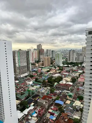 a view of a city with tall buildings at Nestled Haven in Manila
