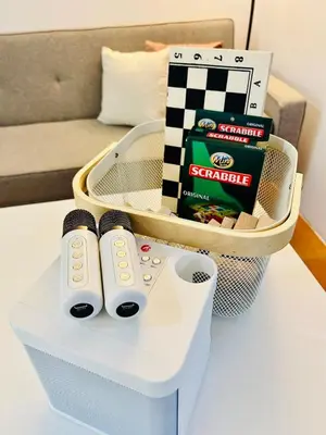 a box with two remote controls sitting on a table at 2BR Relaxing Oasis with pool access Sorrento Oasis in Manila