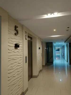 a hallway in a building with a number on the wall at SHORE 2 Residences by ASKrentals in Manila