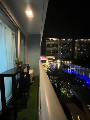 a restaurant with a view of a city at night at R&D comfy staycation in Manila