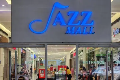 a store front of a mall with a sign on it at Boho City View 1br Apt in Makati with Netflix in Manila