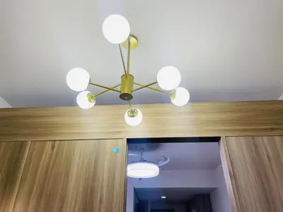 a chandelier hanging from a ceiling in a room at 1126 S Residences SMDC Condo near W Mall & MOA by Prime Stay in Manila