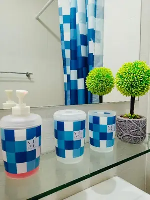 three blue and white cups sitting on a counter with plants at Maldives Suites, Azure Urban Resorts and Residences in Manila