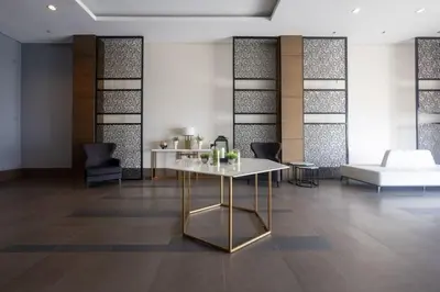 a room with a table and chairs and a couch at 1 BEDROOM Staycation in Pasay in Manila