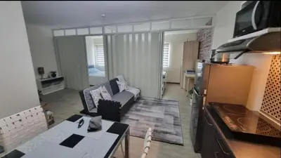 a living room with a couch and a table at Joms Cozy Staycation in Calamba