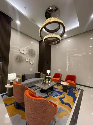 a living room with a couch and a table and chairs at Luxury Apartment near Okada Manila and Solaire in Manila
