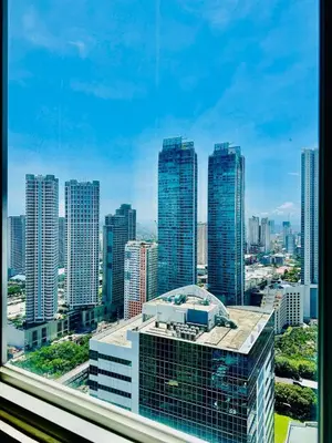 a view of a city skyline with tall buildings at Elegant Studio at Ortigas Business District, Pasig City in Manila