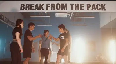 a group of people standing under a sign that reads break from the pack at Chic Luxury Air condo 2 Bedroom Finest City Living Air Makati Gym Swim Park 300 in Manila