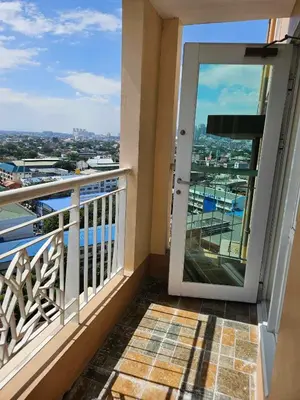 a balcony with a view of the water at 3BR at The Rochester in Manila