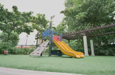 a playground with a slide in a park at 3BR at The Rochester in Manila