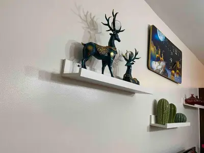 a shelf with a statue of a deer on a wall at Cosmo Nest Air Skyline One BR Makati 2270 Gym Swim Park 300 Mbps in Manila