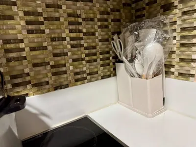 a container of utensils is sitting on a table at Heavenly holiday Italian Rome Air Makati Gym Swim Park 300 in Manila