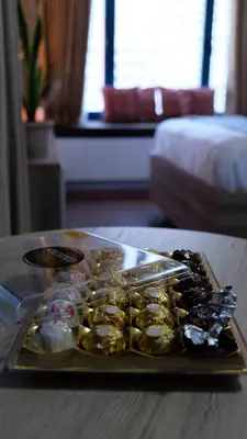 a tray of food on a table in a hotel room at Air residence Fantasy Sophisticated Heaven on earth Gym Swim Park 300 MB in Manila