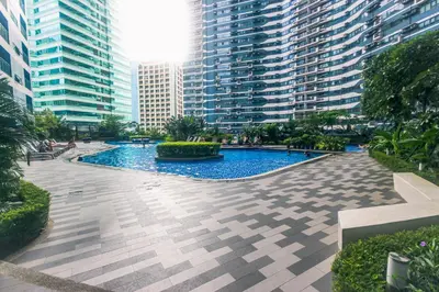 a pool in the middle of a city with tall buildings at Air residence Fantasy Sophisticated Heaven on earth Gym Swim Park 300 MB in Manila