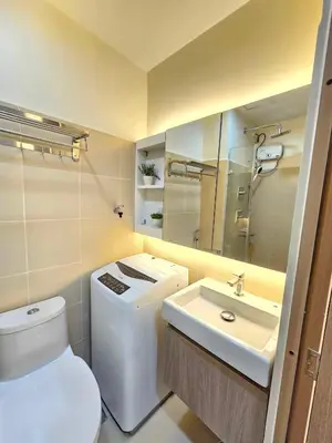 a bathroom with a toilet and a sink at Shore 3 Tower 4 Amenity View Pasay in Manila