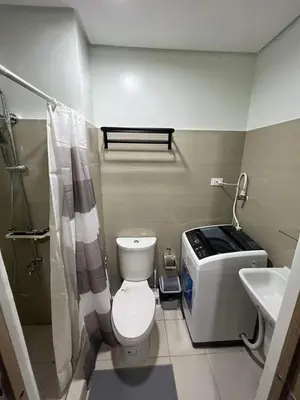 a bathroom with a toilet and a sink at Shore Residence 1 Bedroom Staycation in Manila