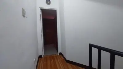 an empty hallway with a door and a stair case at Affordable Whole house 2-story 3 bedroom Greenpark villas imus phase 1 in Imus