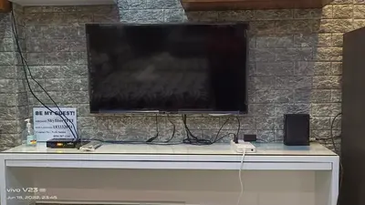 a flat screen tv sitting on top of a table at Nethcondo in Manila