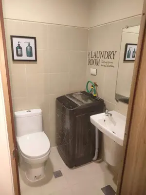 a small bathroom with a toilet and a sink at 1BR with balcony Condotel in MOA Complex, Entertainment City, near NAIA, free wifi, netflix in Manila