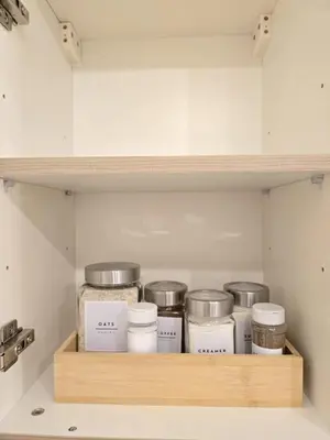 a shelf full of food items in a pantry at SG Urban Staycation in Manila