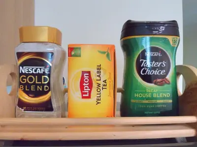 a shelf with two bottles of condiments on it at Avant Apartments at The Fort in Manila