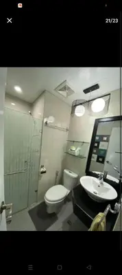 a bathroom with a toilet and a sink at One Palm Tree Villas Near NAIA terminal 3 in Manila