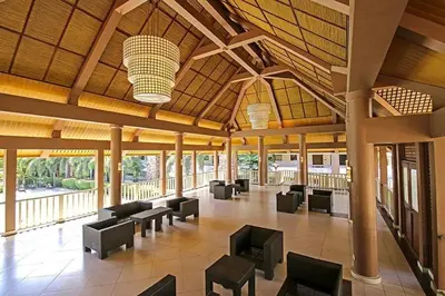 a lobby with couches and chairs in a building at Staycation with Mickey & Minnie One Oasis Pasig in Manila