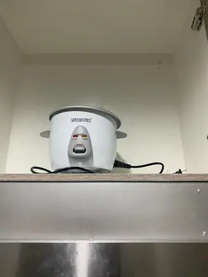 a slow cooker sitting on top of a shelf at The Skycabin at S Residences in Manila