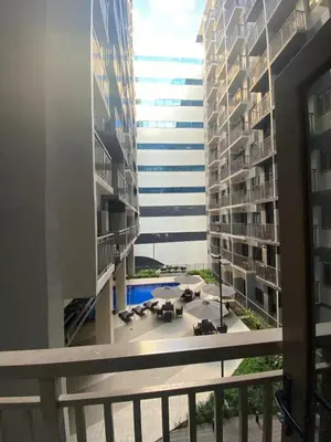 a view from the balcony of an apartment building at The Skycabin at S Residences in Manila