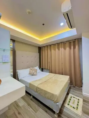 a bedroom with a bed in a room at Skyrest Staycation - Azure Urban Resort in Manila