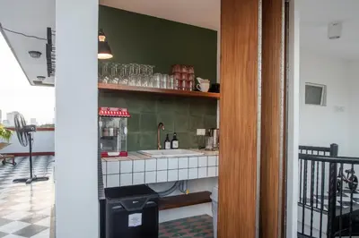 a kitchen with a sink and a counter top at MiraNamin Nest GUMAMELA - Family Suite in Historic Home with Indoor Plunge Pool, Garden View, Pet-Friendly, Self-Service Breakfast in Manila